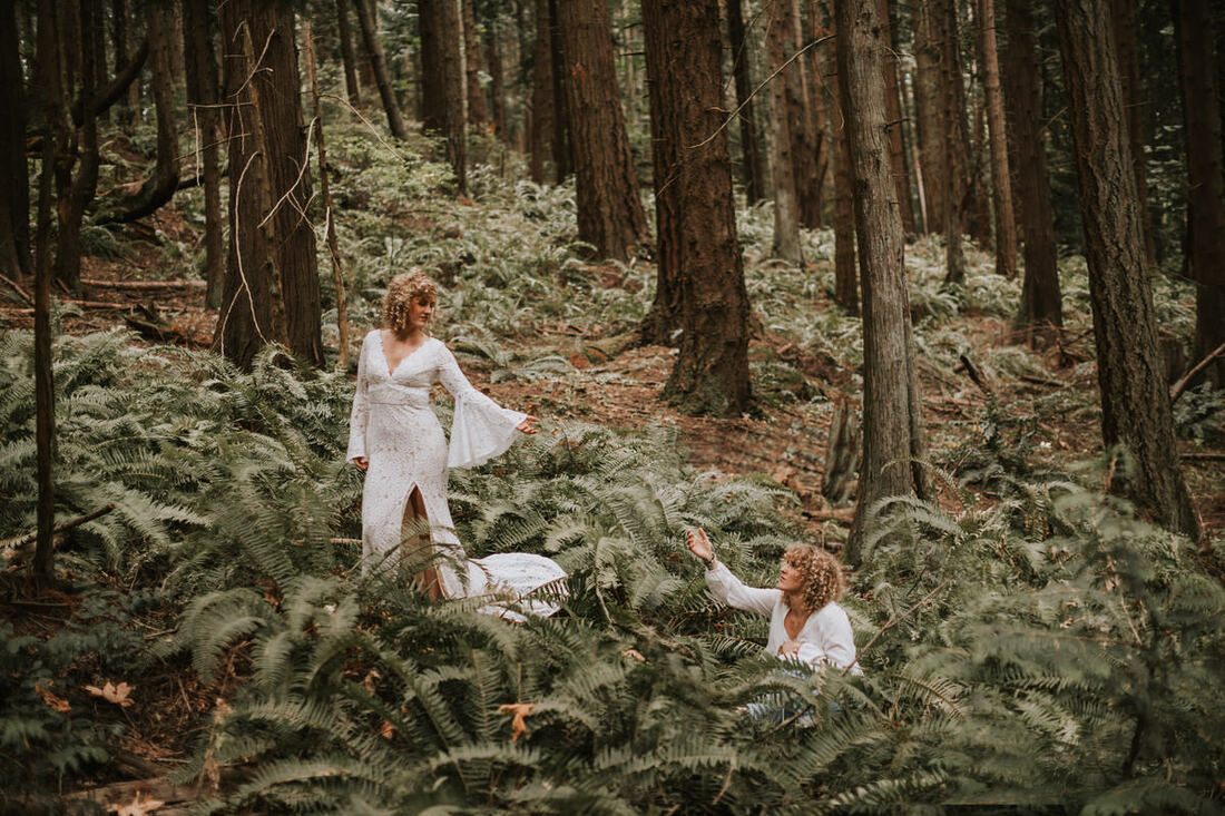 Savannah and Amanda posing together in evening gowns on a forest trail in Kirkland, WA