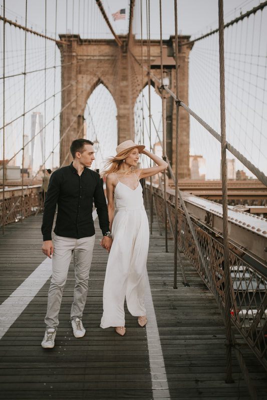 Valentina and Alex watching the sunrise together on the Brooklyn Bridge