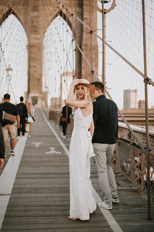 Valentina and Alex sharing a quiet moment against a Brooklyn brick wall