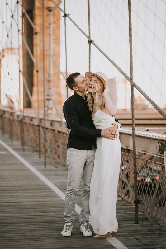 Close-up portrait of Valentina and Alex laughing together in Brooklyn