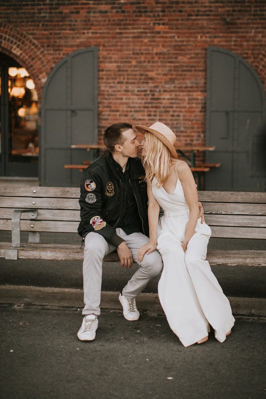 Valentina in her Schone Bride romper walking with Alex through Brooklyn