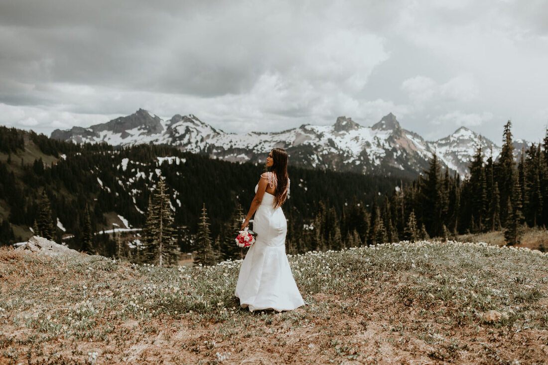 Couple sharing a quiet moment together during their Mt. Rainier vow renewal ceremony.
