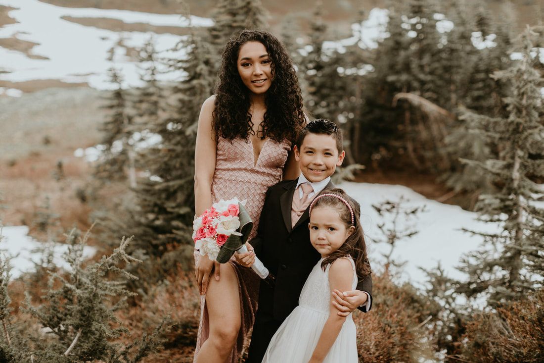 Golden light filtering through the trees during the Navarro family's mountain celebration.