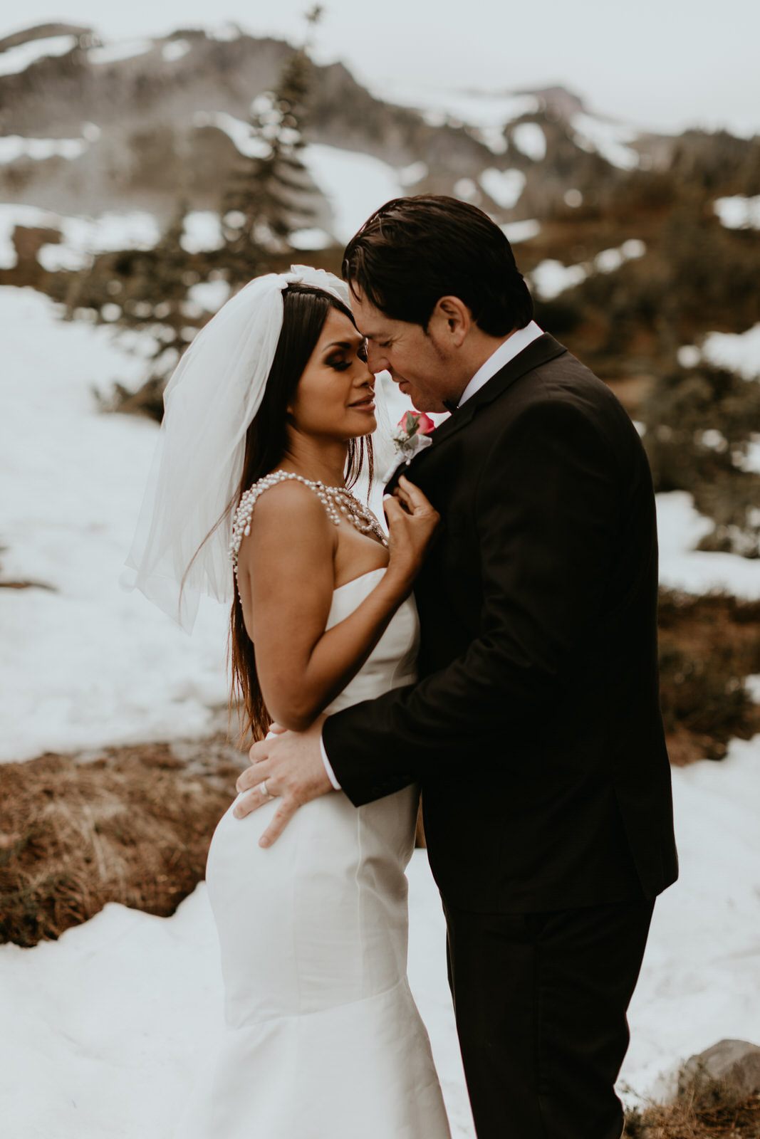 Couple sharing a quiet moment together during their Mt. Rainier vow renewal ceremony.