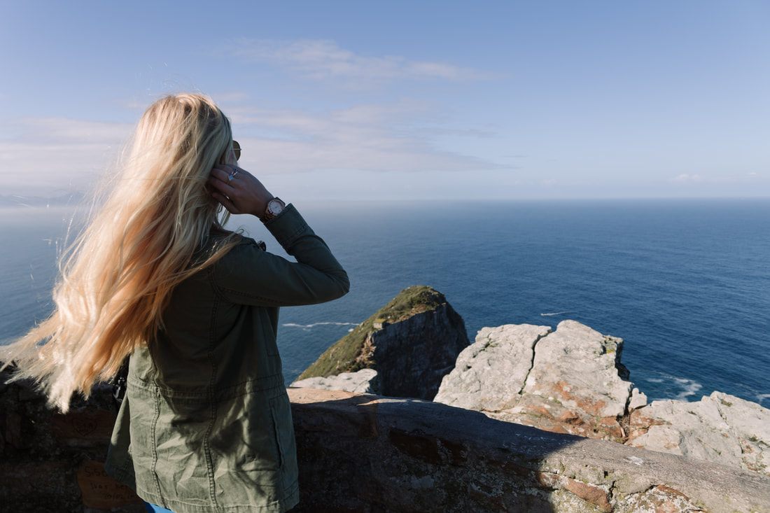 Photo of a coastal road winding along the Cape Peninsula in Cape Town, South Africa