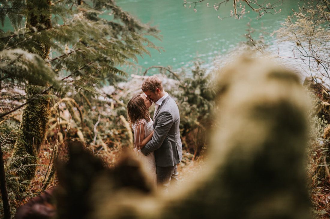 Couple exchanging vows during their elopement at That PNW Cabin in Index, WA