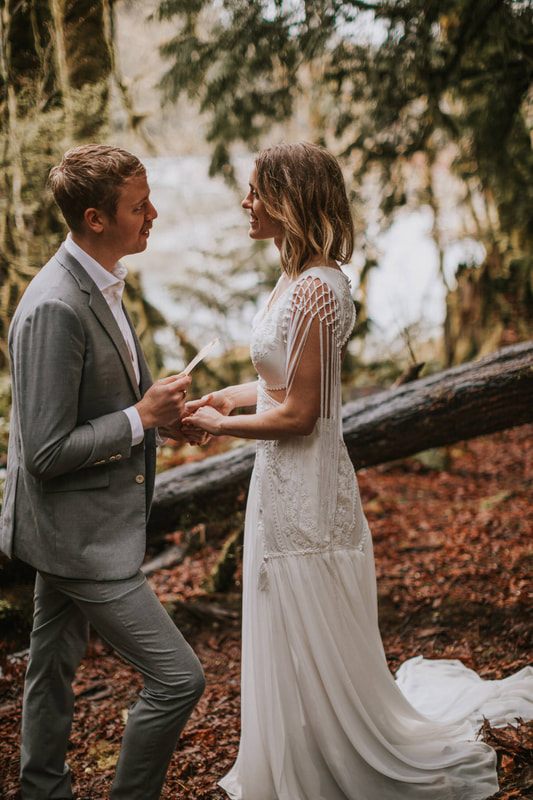 Newlyweds toasting during their small cabin reception