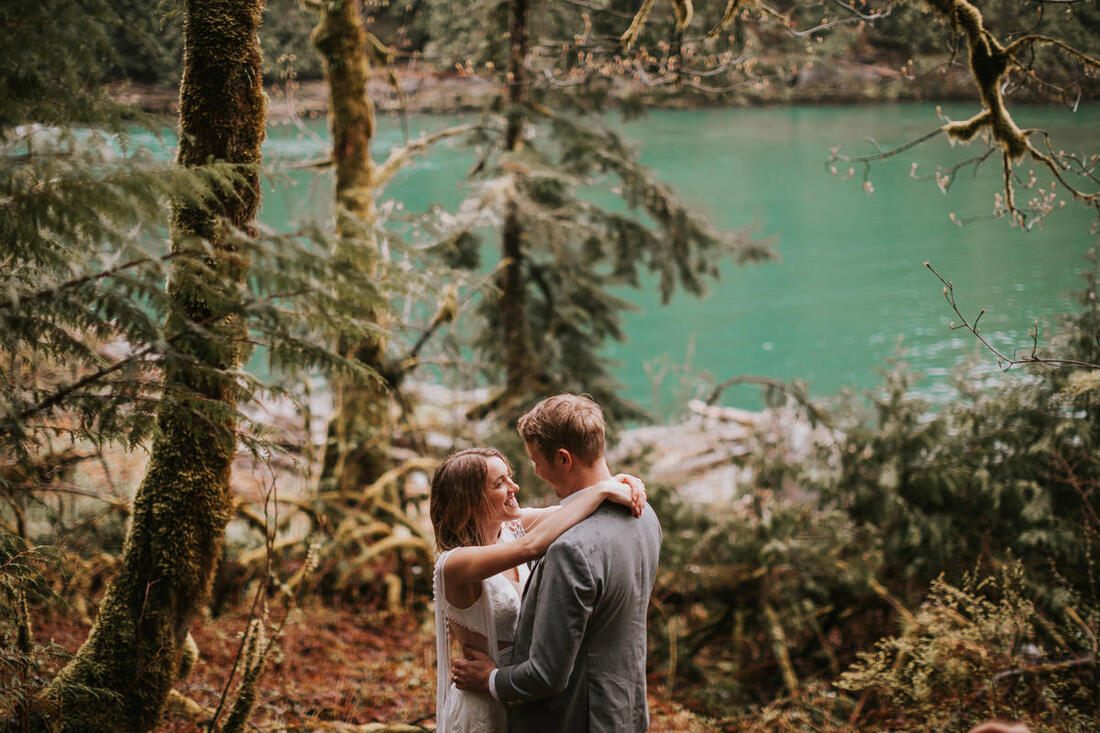 Couple embracing at sunset near the Cascade foothills