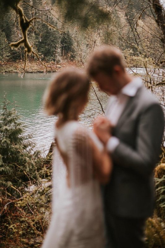 Close-up portrait of the couple smiling at each other