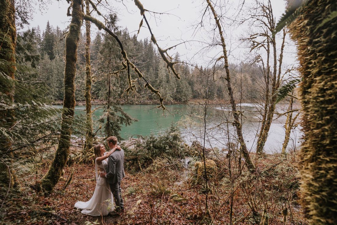 Couple laughing together during their forest elopement portraits