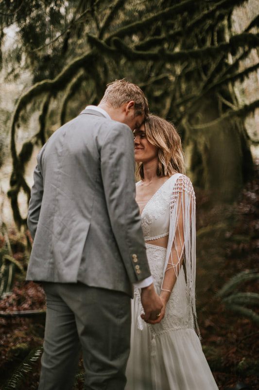 Wide shot of the couple walking through the Cascade wilderness