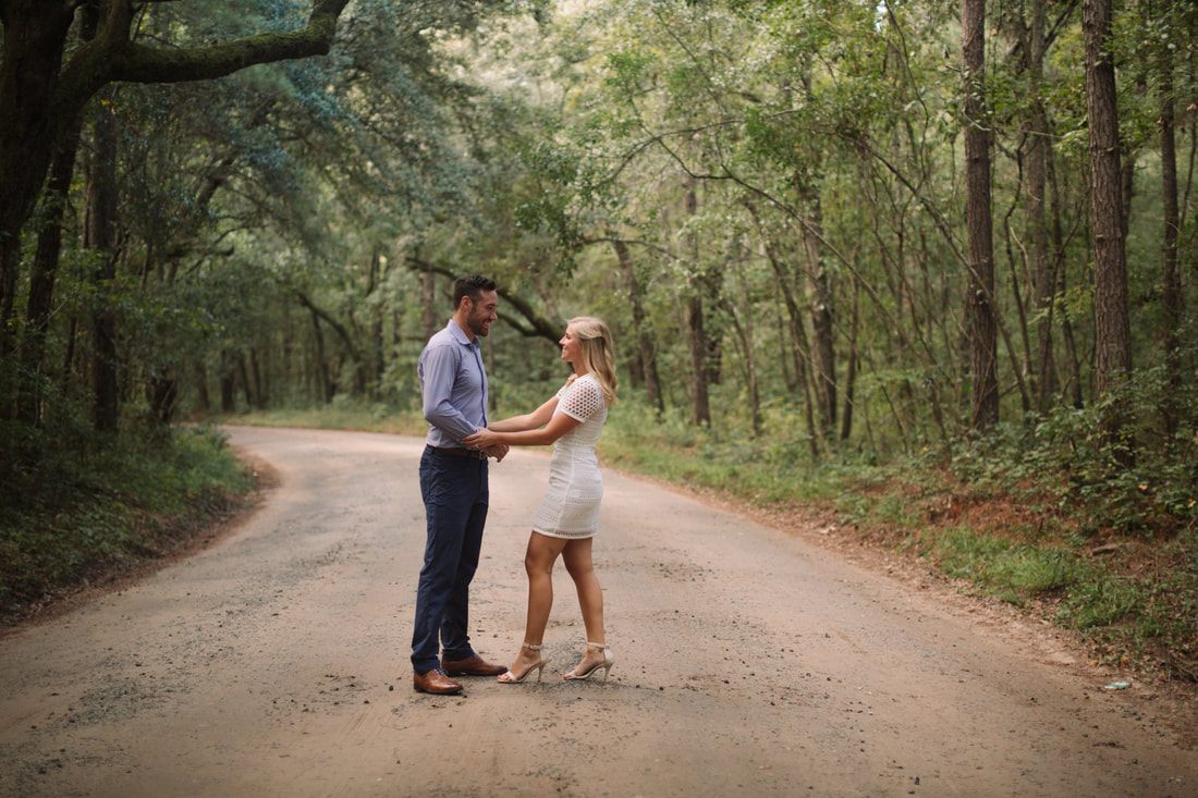Andrew embracing near the tree beneath Spanish moss near Charleston