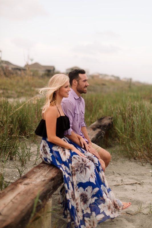 The couple embracing near the tree along the Johns Island coast