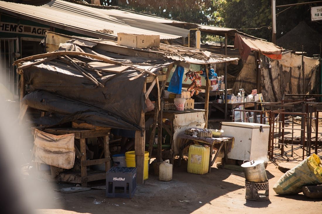 Vendor selling handmade goods at an informal market in Livingstone, Zambia