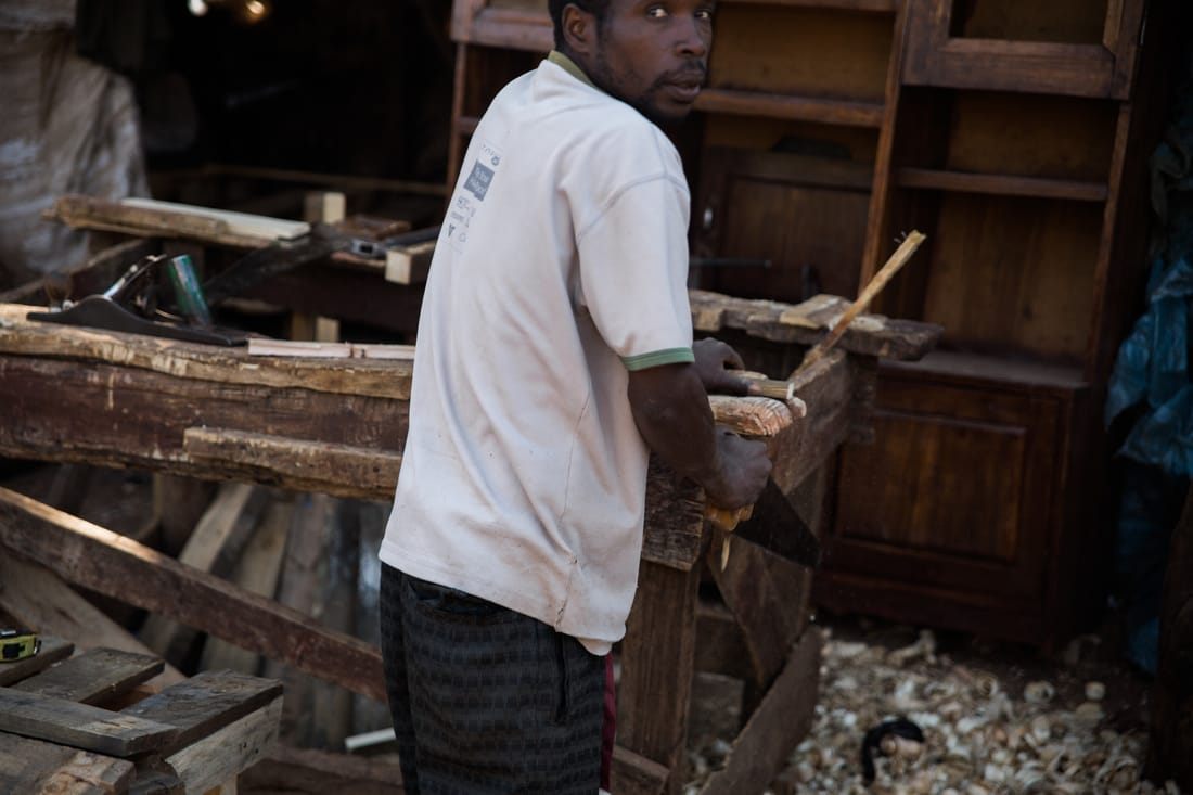 Vendor selling handmade goods at an informal market in Livingstone, Zambia