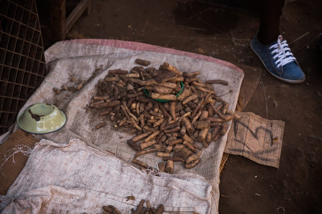 Local shoppers browsing an informal market street in Zambia