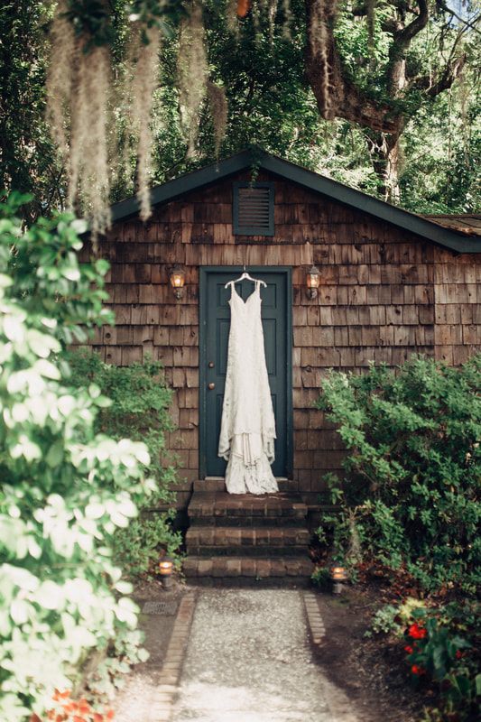 Bride and groom portrait with the plantation's historic architecture behind them