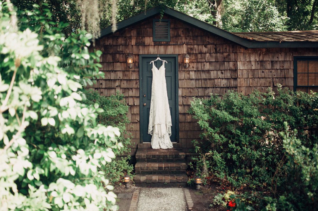 Reception details set up under string lights at Magnolia Plantation