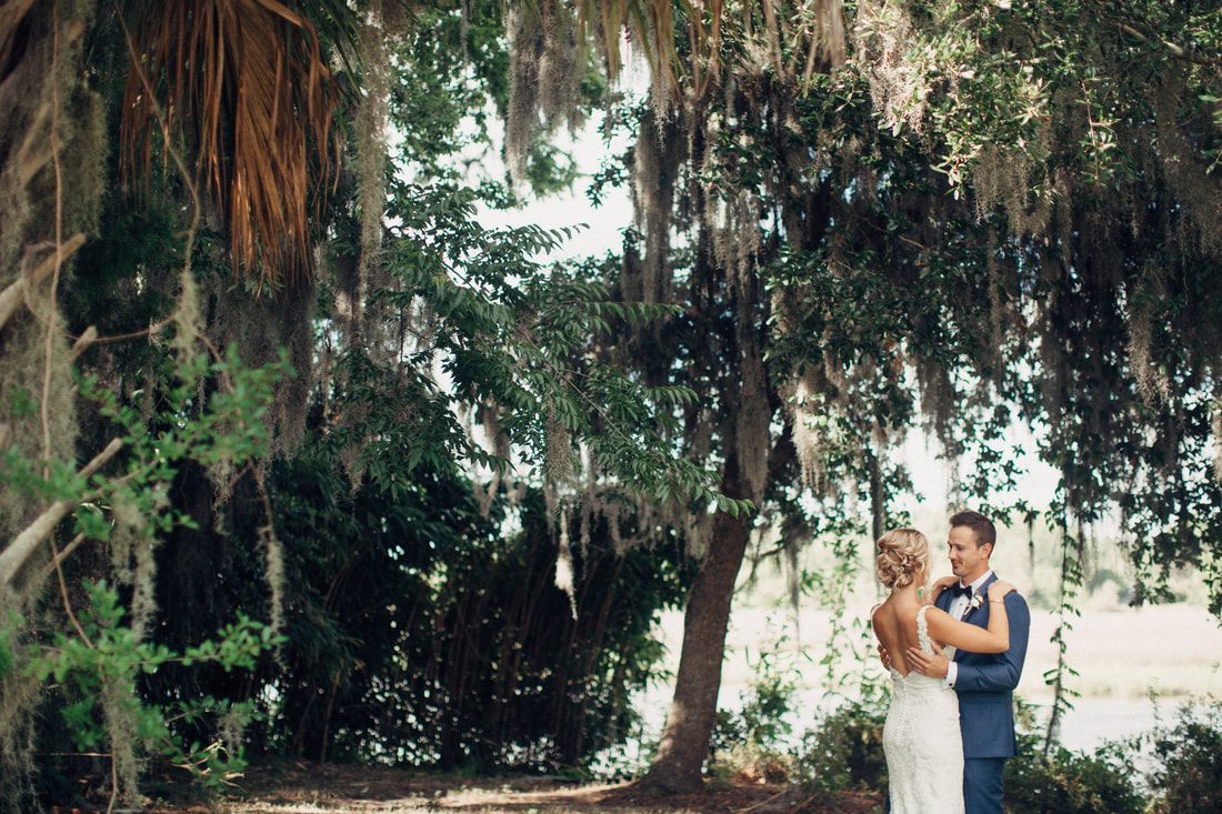 Bride's bouquet toss during the Charleston wedding reception