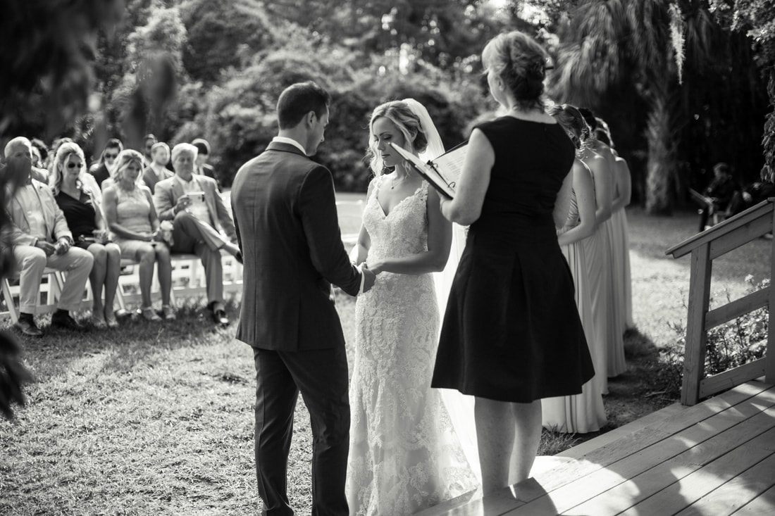 Reception details set up under string lights at Magnolia Plantation