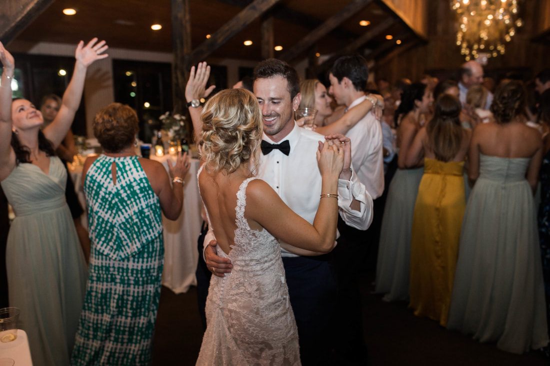Candid portrait of the newlyweds walking through the Charleston gardens