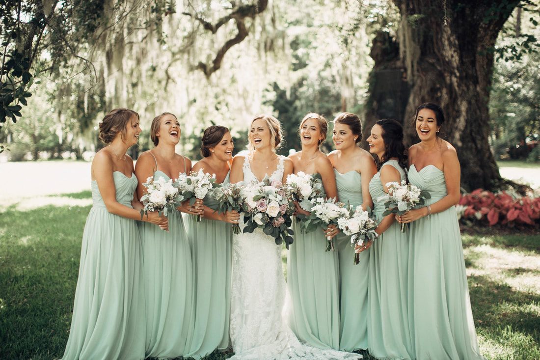 Bride laughing during her getting-ready portraits at Magnolia Plantation