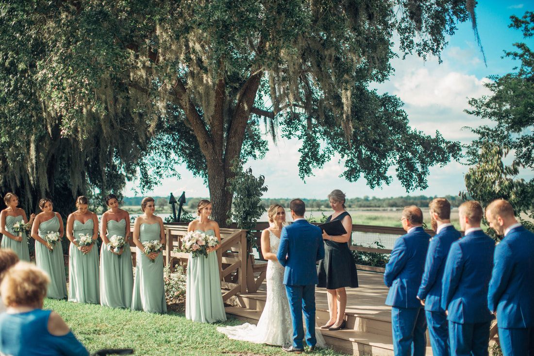 Guests celebrating during the recessional at the Charleston wedding ceremony