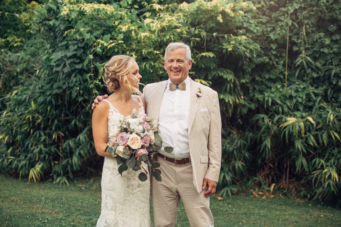 Reception toast captured mid-laugh from the maid of honor