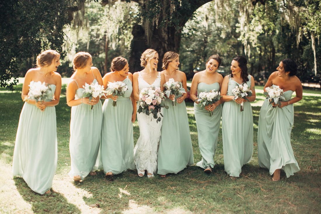 Wedding portrait of Ashley and Madison in front of the plantation house
