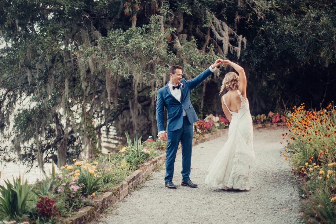 Candid dance floor moment during the Charleston wedding reception