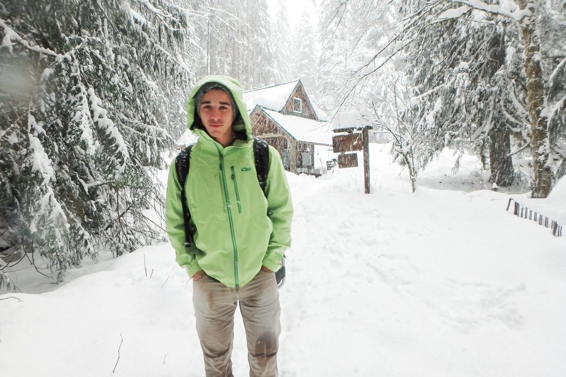 Snow-covered evergreens at Gold Creek during a winter engagement session