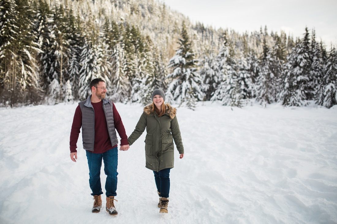 Snow-covered evergreens at Gold Creek during a winter engagement session