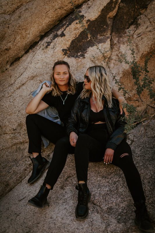 A candid portrait of Ciarra and AJ laughing in the California desert.