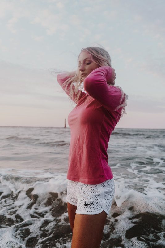 Spring style editorial shot along the shoreline at Folly Beach.