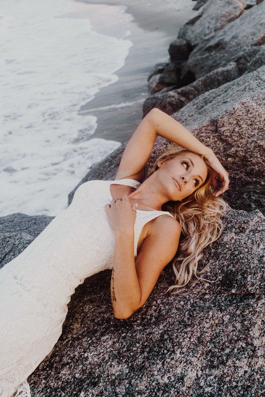 Folly Beach fashion shoot featuring a Free People denim look.