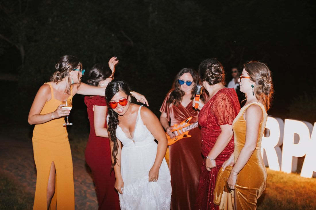 Bride getting ready with her bridesmaids before the Charleston ceremony