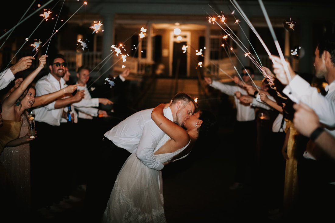 Megan and Jordan sharing a laugh together at their Magnolia Plantation wedding in Charleston