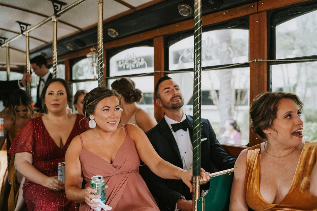 Wedding party riding the Lowcountry trolley through historic downtown Charleston