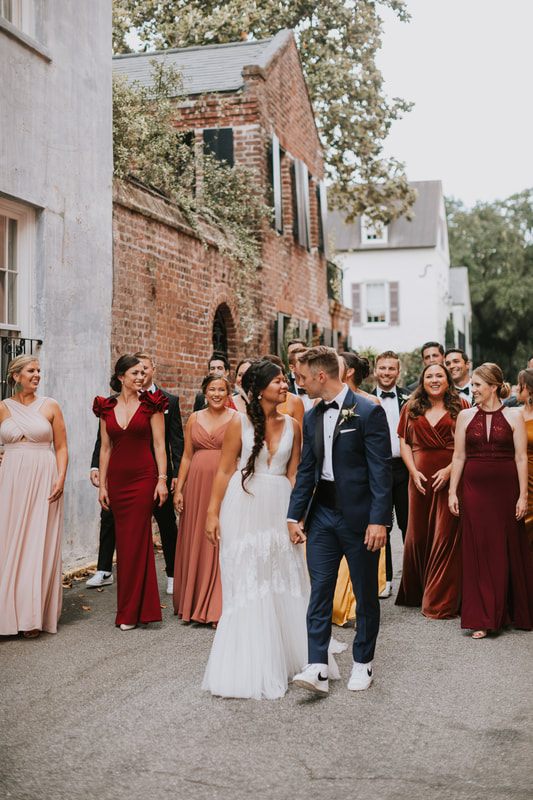 Guests dancing on the reception dance floor at this festival-inspired Charleston wedding