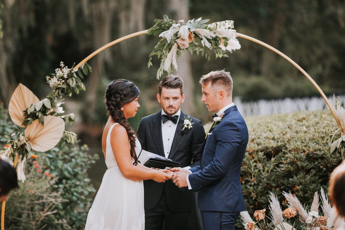 Candid moment between the newlyweds during their Charleston wedding reception