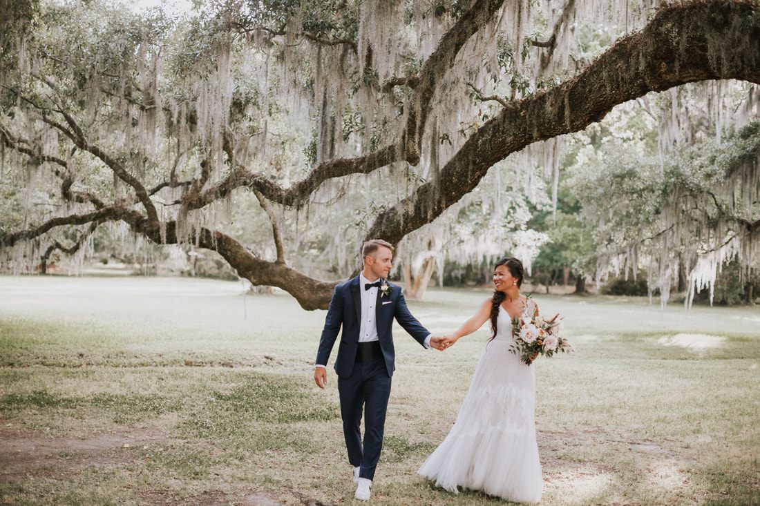Guests dancing on the reception dance floor at this festival-inspired Charleston wedding