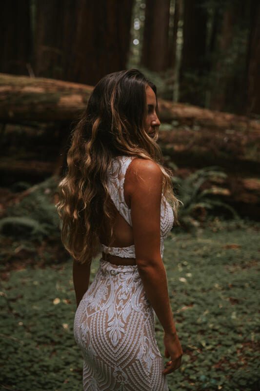 Bridal portrait with dramatic shafts of light through the redwood canopy