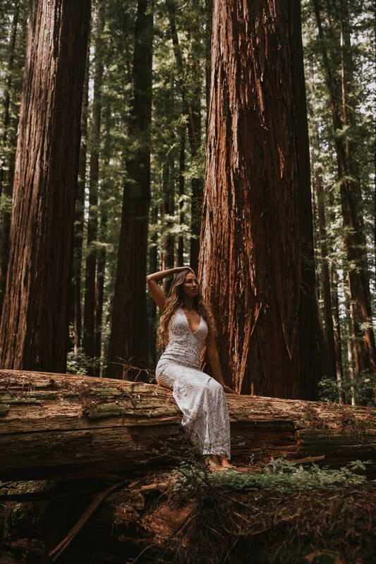 Bride hiking a forest trail during her Redwood National Forest elopement session