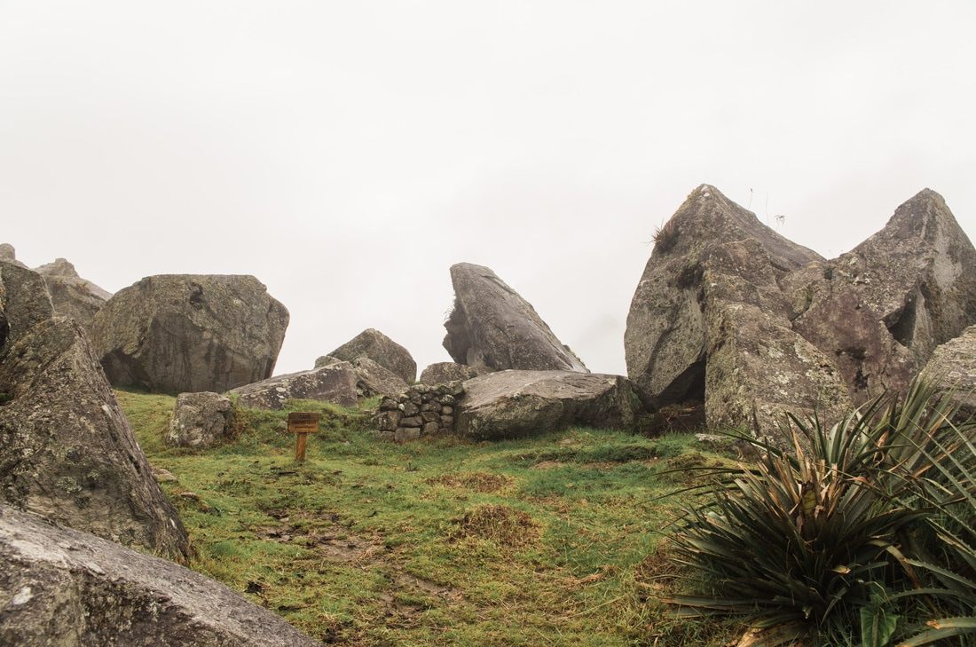 View of Huayna Picchu peak rising above the ancient ruins