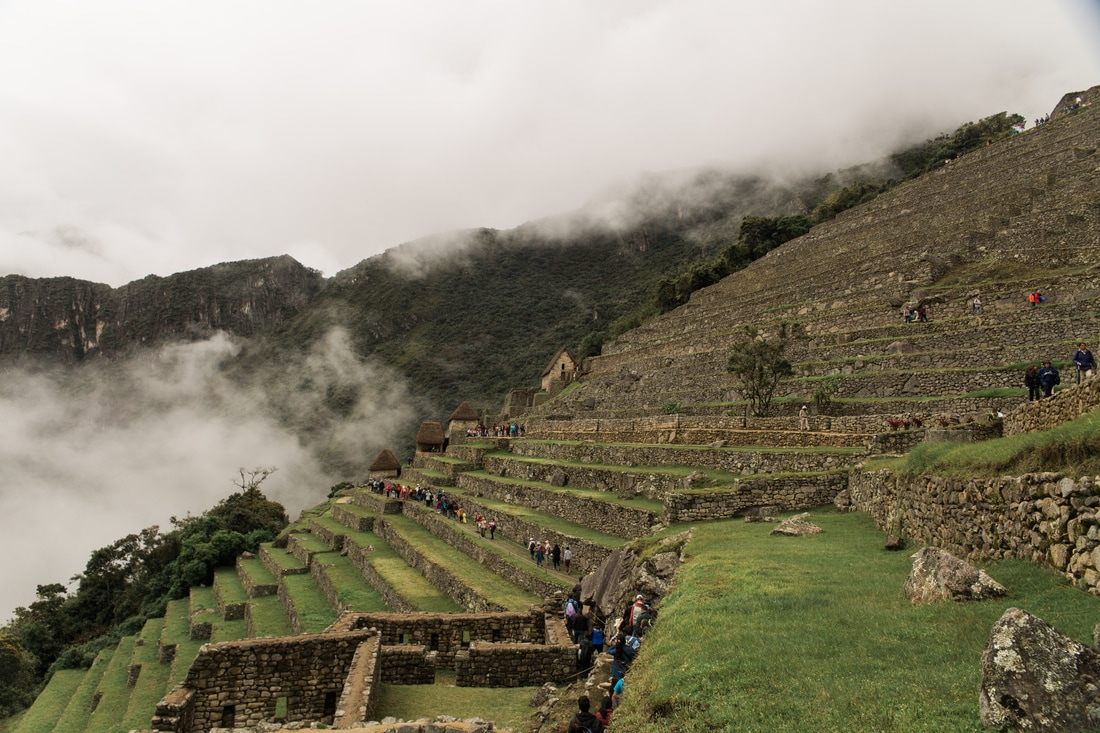 Stone pathway leading through the heart of the Machu Picchu ruins