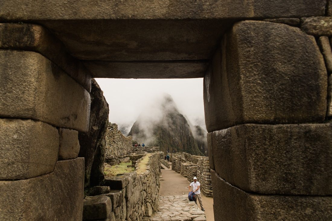 Ancient ruins framed by dramatic Andes peaks at Machu Picchu