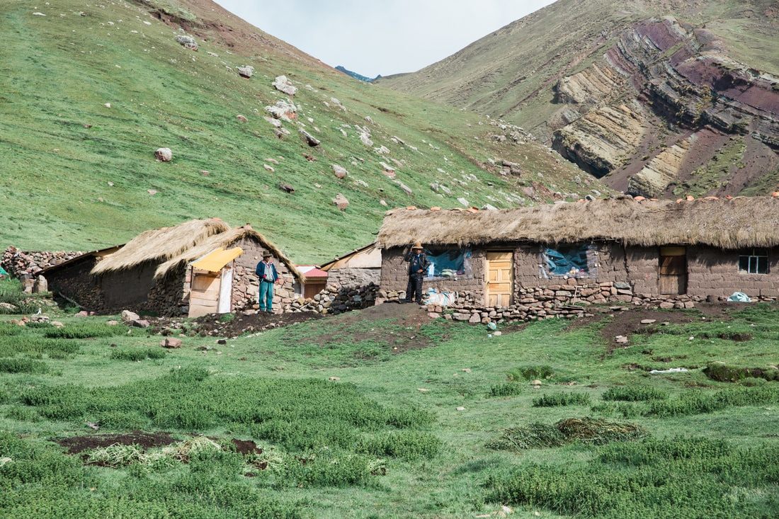 Hikers reaching the summit viewpoint of Rainbow Mountain, Peru