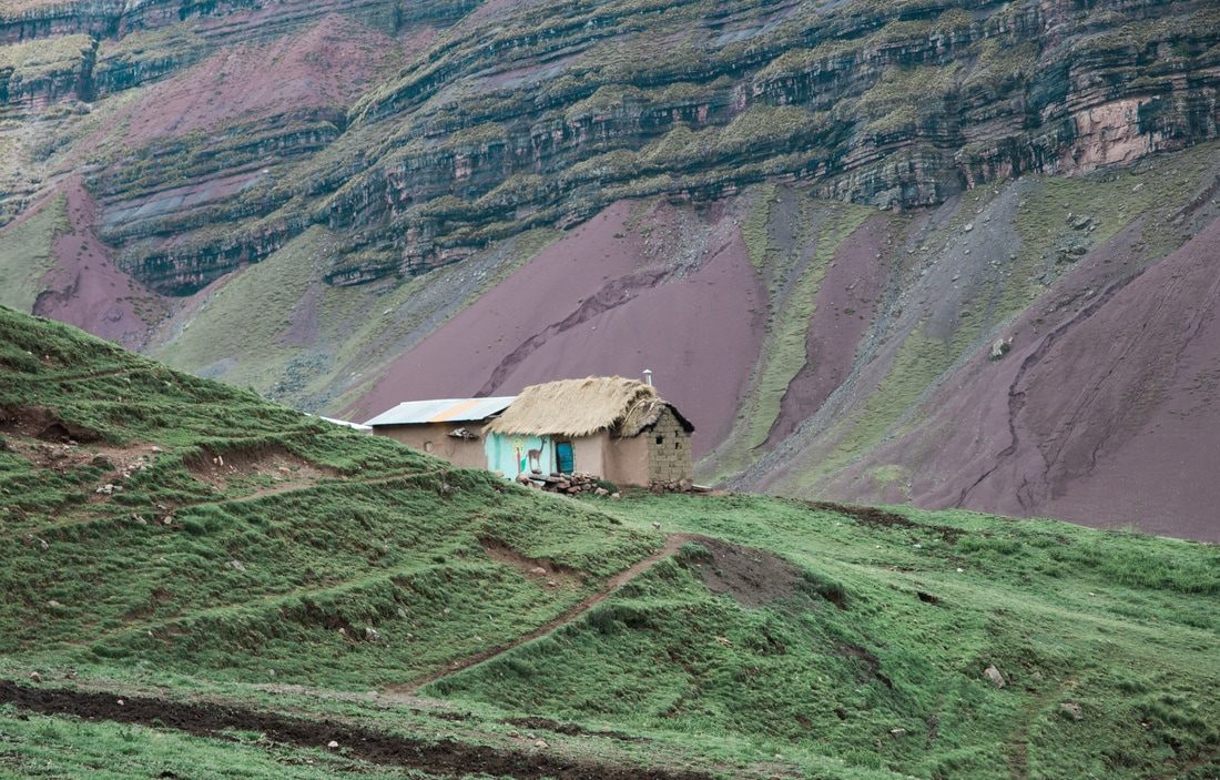 Hikers walking the trail toward Rainbow Mountain in the Cusco region of Peru