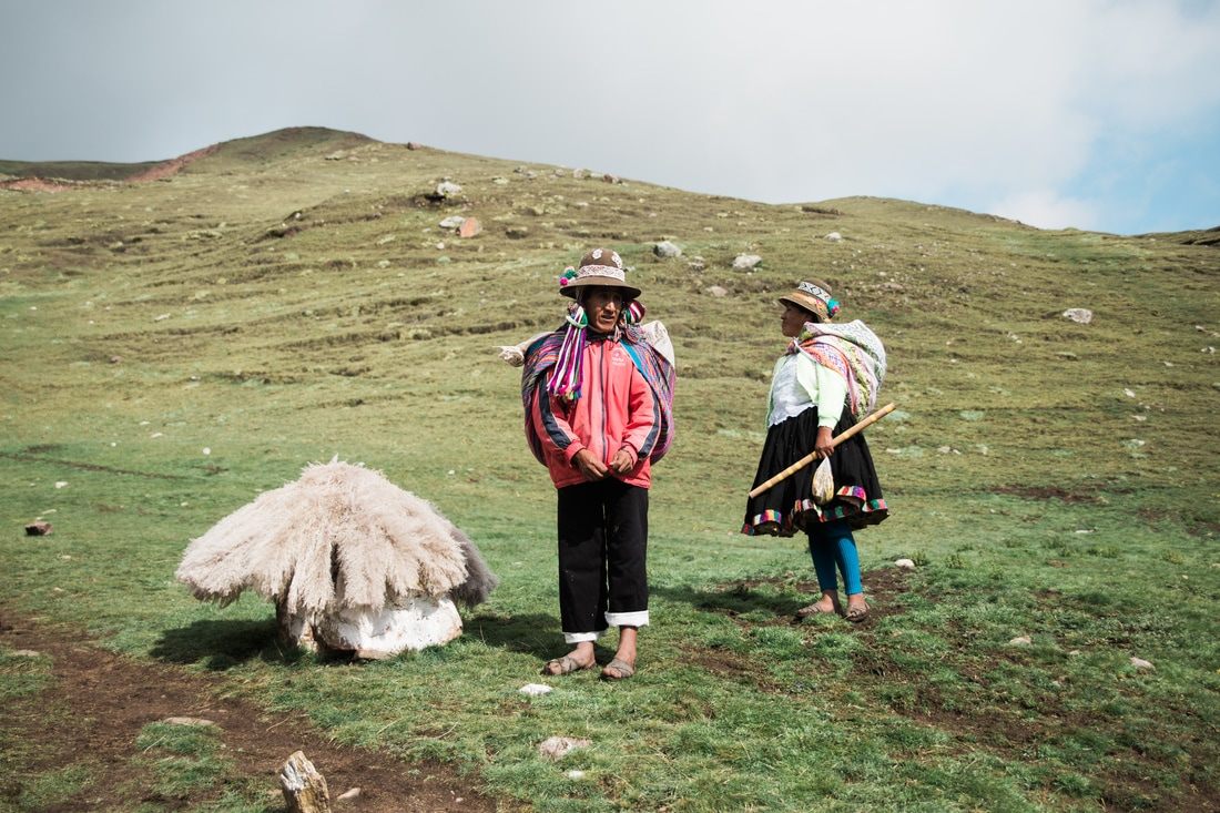 Hikers walking the trail toward Rainbow Mountain in the Cusco region of Peru