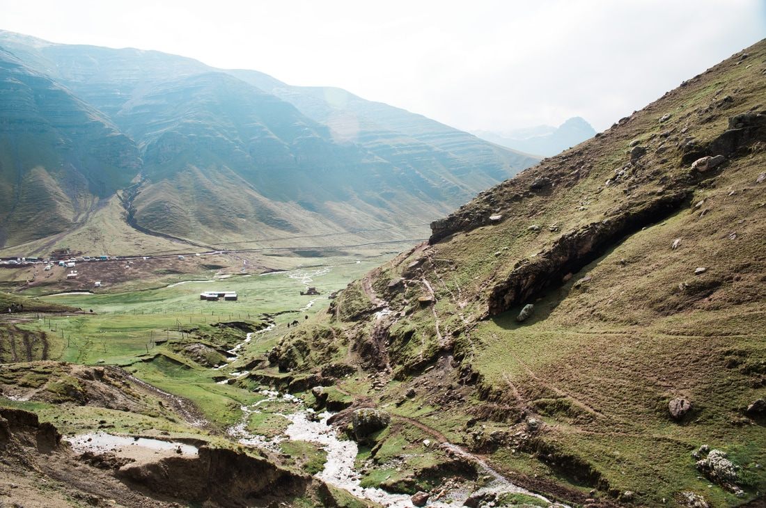Panoramic view of the mineral-striped Rainbow Mountain range in Peru